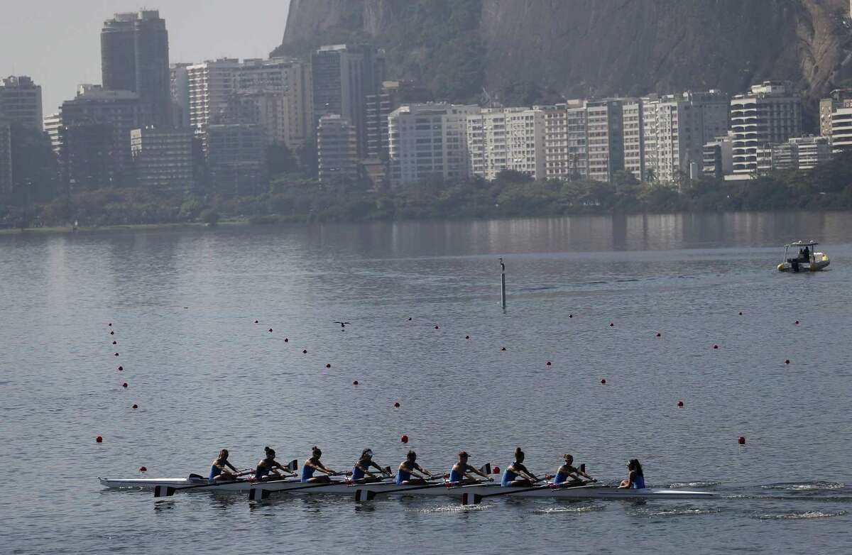 Italian rowers practice for the 2015 World Rowing Junior Championships on Rodrigo de Freitas lake in Rio de Janeiro, Brazil, Tuesday, Aug. 4, 2015. The head of the governing body of world rowing says he will ask for viral testing at the rowing venue for next year’s Rio Olympics, and says he expects all other water sports in Rio to follow suit. The move comes after an Associated Press investigation last week showed a serious health risk to about 1,400 Olympic athletes who will compete at water venues around Rio that are rife with human waste and sewage.