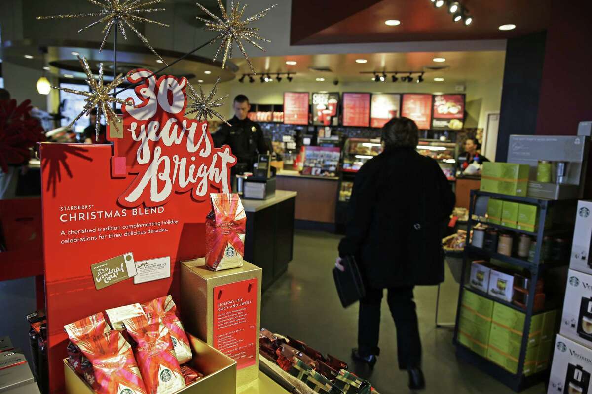 A sign at a Starbucks store advertises the 30th Anniversary of Starbucks’ Christmas Blend coffee, in Seattle.