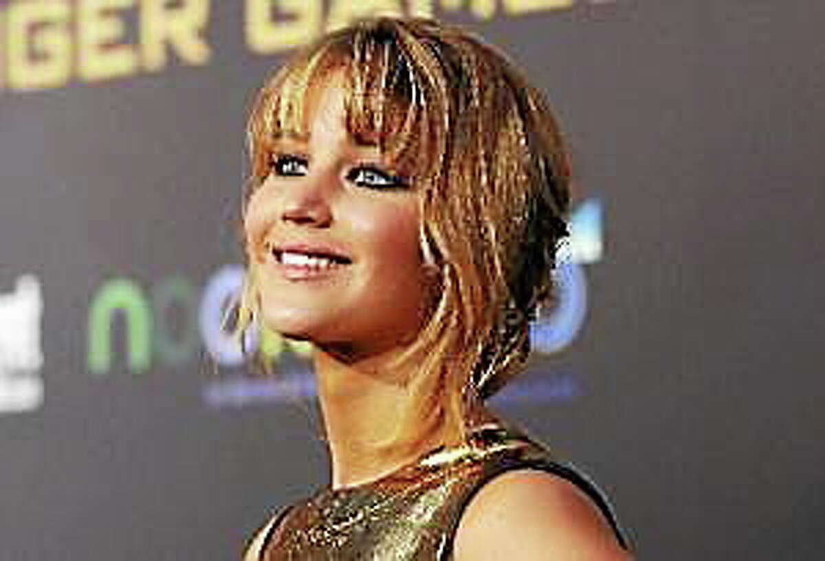 Jennifer Lawrence poses at the premiere of “The Hunger Games” at Nokia Theatre in Los Angeles, California in this March 12, 2012 file photo.