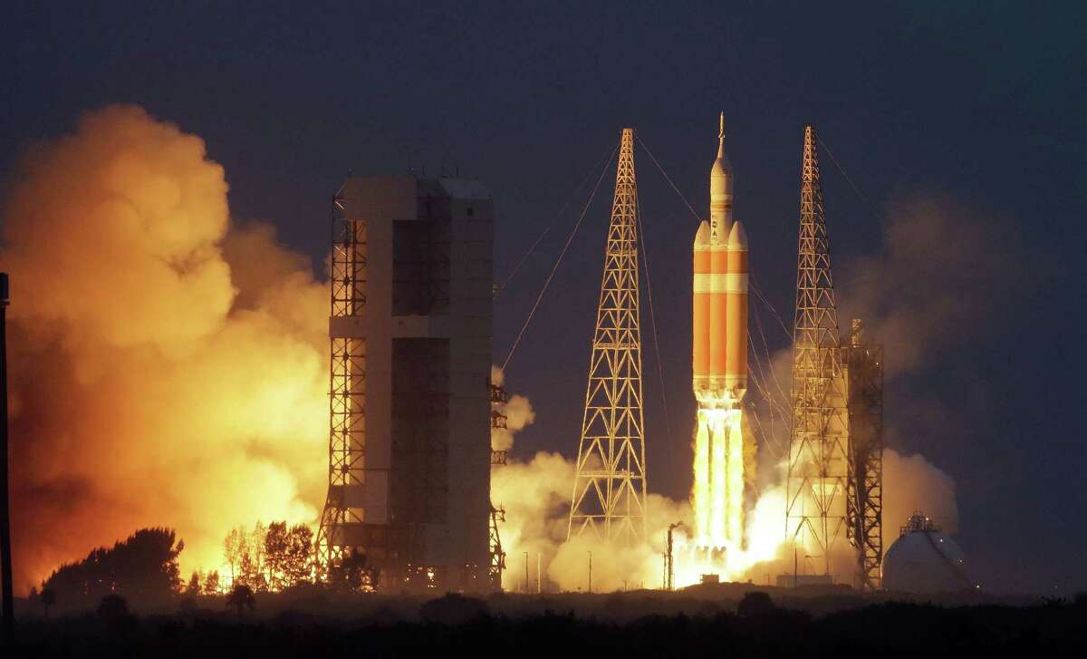 NASA's Orion spacecraft, atop a United Launch Alliance Delta 4-Heavy rocket, lifts off on its first unmanned orbital test flight from the Cape Canaveral Air Force Station Friday, Dec. 5, 2014, in Cape Canaveral, Fla. (AP Photo/Chris O'Meara)