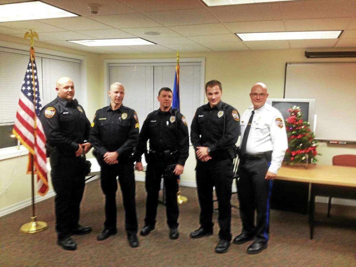 From left are: East Hampton police officer Adam Brault, Sgt. Jared Boynton, officers Jason Wishart and Hardie Burgin; and Police Chief Sean Cox.