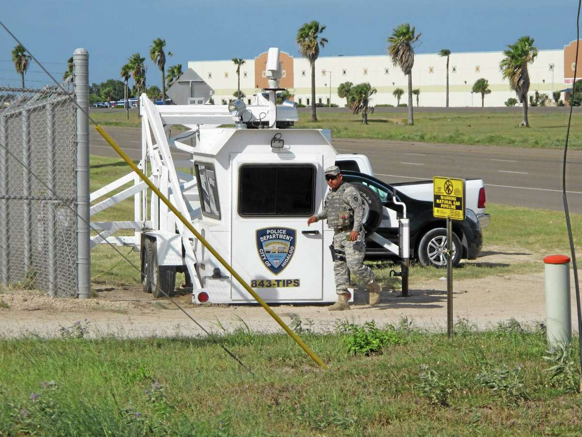 A Texas National Guardsman exits an observation tower in Hidalgo, Texas, on Thursday, Aug. 14, 2014. Several dozen soldiers deployed in the Rio Grande Valley are part of the up to 1,000 troops called up by Gov. Rick Perry last month, Texas National Guard Master Sgt. Ken Walker of the Joint Counterdrug Task Force said Thursday.