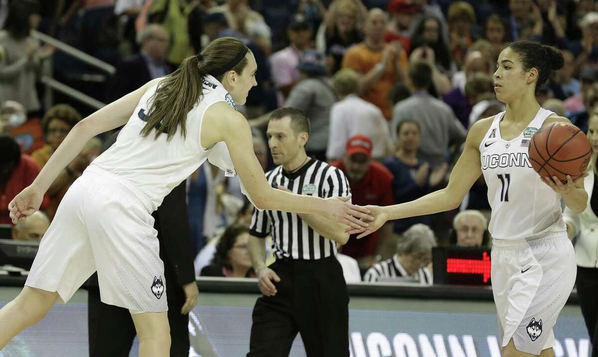 Connecticut forward Breanna Stewart (30) celebrates with Connecticut guard Kia Nurse (11) after the second half of the NCAA Women's Final Four tournament college basketball semifinal game, Sunday, April 5, 2015, in Tampa, Fla. Connecticut won 81-58. (AP Photo/John Raoux)