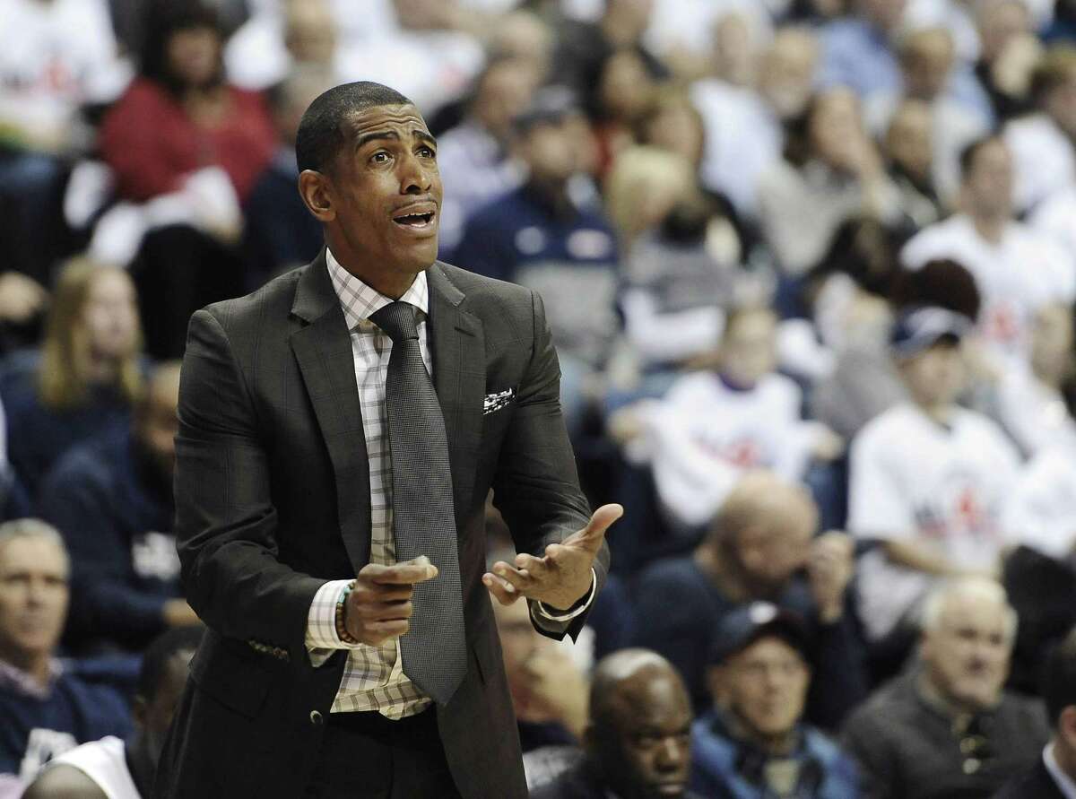 UConn coach Kevin Ollie reacts during the first half of the Huskies’ loss to Texas on Sunday in Storrs.