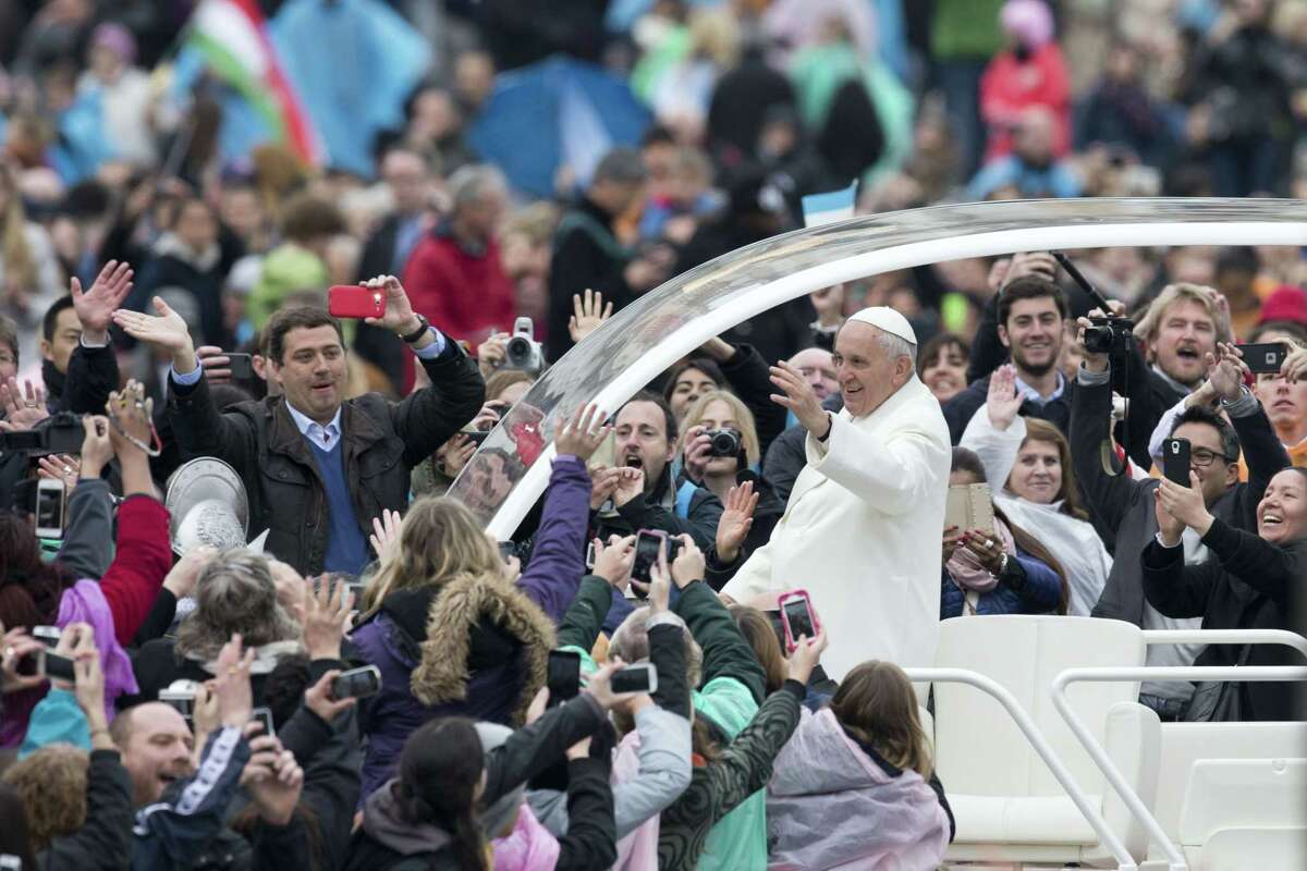 Pope Francis leaves St. Peter’s square at the Vatican after he celebrated an Easter mass on Sunday, April 5, 2015.