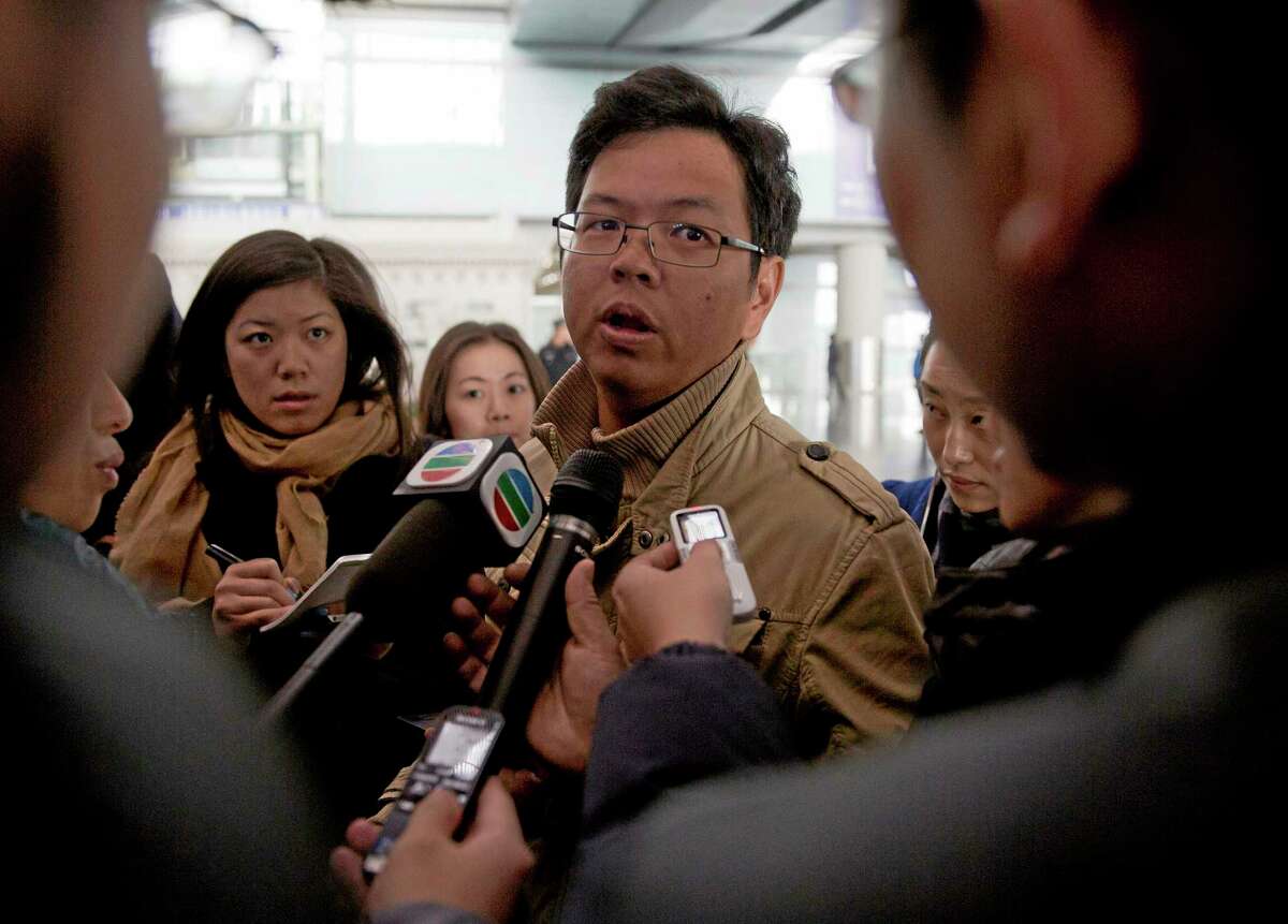 A Malaysian man who says he has relatives on board the missing Malaysian Airlines plane talks to journalists at Beijing’s International Airport Beijing, China, Saturday.