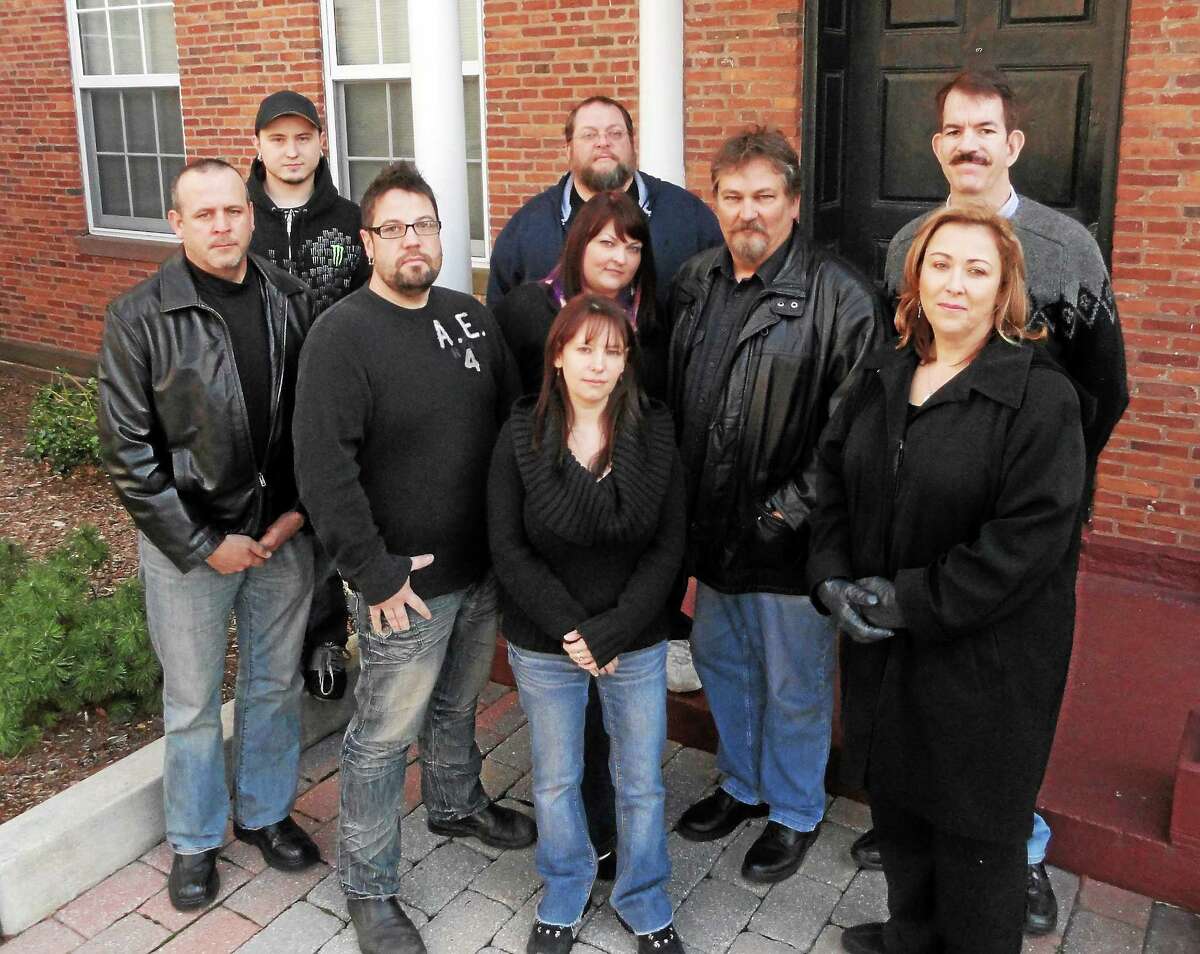 Members of the Ghosts of New England Research Society stand in front of the Armory in Middletown.