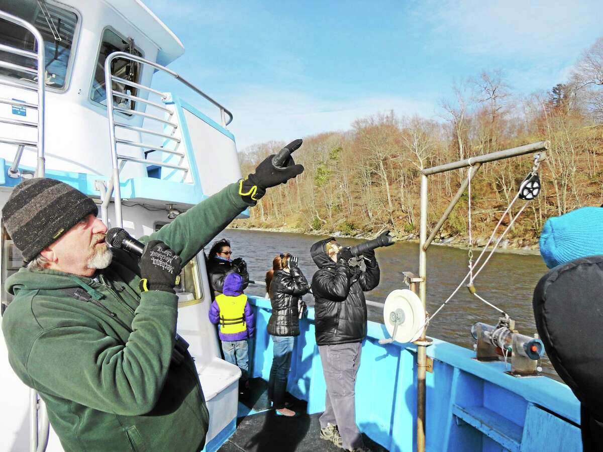 Environmental educator Bill Yule leads the boat tours and helps participants spot bald eagles, wintering hawks and water fowl and other wildlife from the deck of Enviro-Lab III in Essex.