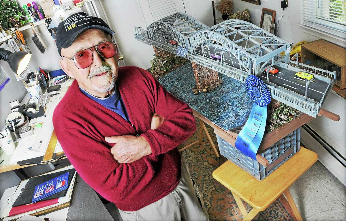 Joseph Virgadula is shown in his design studio at his Portland home with his award-winning model of the Middletown-Portland Arrigoni Bridge. Virgadula, who has macular degeneration, spent one month designing his model of the bridge and three months constructing using everything from cutting his own balsa wood, to toothpicks and wooden paint stirrers.
