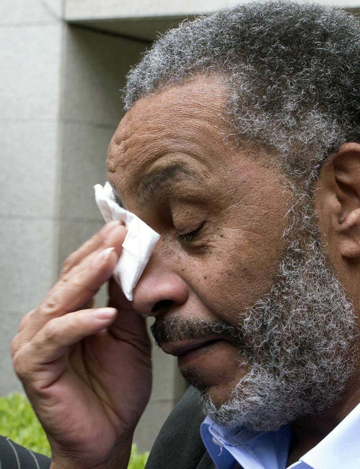 Anthony Ray Hinton wipes away tears after greeting friends and relatives upon leaving the Jefferson County jail, Friday, April 3, 2015, in Birmingham, Ala. Hinton spent nearly 30 years on Alabama’s death row, and was set free Friday after prosecutors told a judge they won’t re-try him for the 1985 slayings of two fast-food managers.