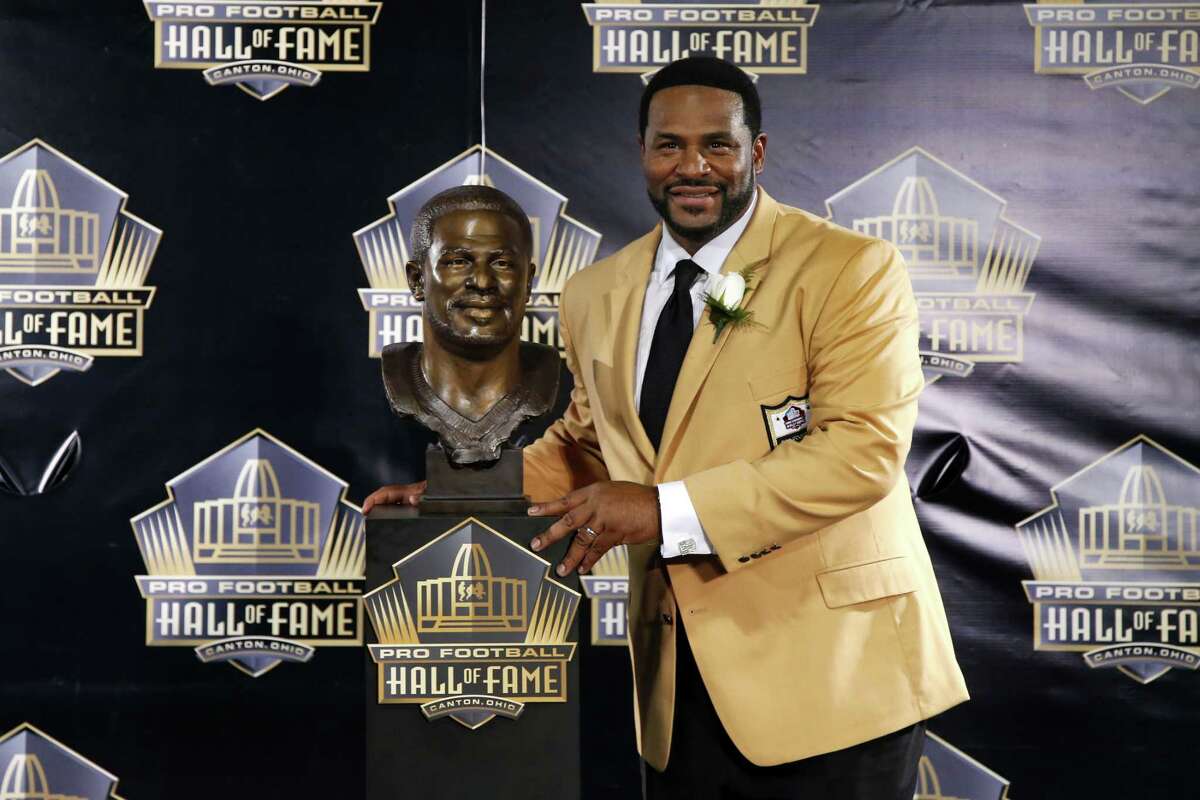 Jerome Bettis poses with his bust during the induction ceremony at the Pro Football Hall of Fame Saturday in Canton, Ohio.
