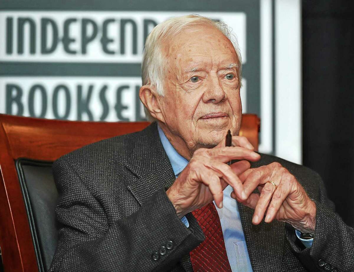 Jimmy Carter, 39th president of the United States, pauses at a signing of his book, “A Call to Action: Women, Religion, Violence and Power,” at the New Haven Lawn Club Tuesday in New Haven.