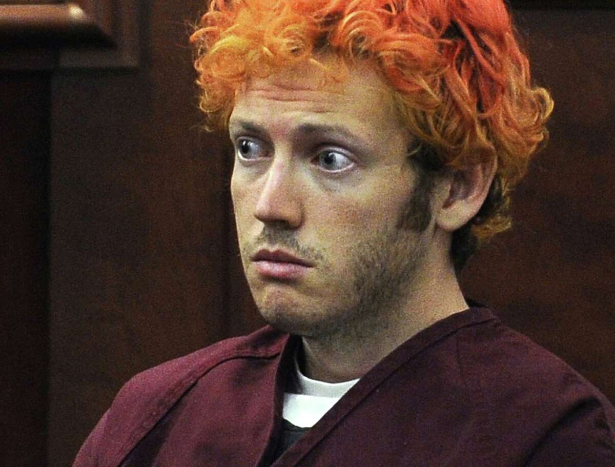 FILE - In this July 23, 2012, file photo, James Holmes, who is charged with killing 12 moviegoers and wounding 70 more in a shooting spree in a crowded theatre in 2012, sits in Arapahoe County District Court in Centennial, Colo. Jurors in the Colorado theater shooting case reached a decision Friday, Aug. 7, 2015, on whether Holmes should be sentenced to life in prison or the death penalty. The same jurors rejected Holmes’ insanity defense and convicted him of murder.