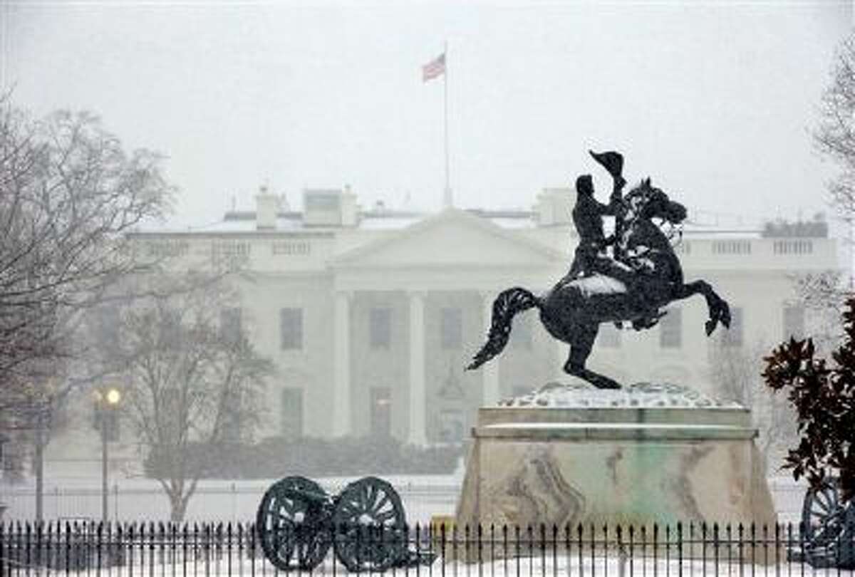 The statue of President Andrew Jackson at the Battle of New Orleans, sculpted in 1853 by Clark Mill sits in the falling snow in Lafayette Park across the street from the White House in Washington, Monday, March 3, 2014. The winter weather prompted area schools and the federal government to close and the National Weather Service has issued a Winter Storm Warning for the greater Washington Metropolitan region. (AP Photo/Pablo Martinez Monsivais)