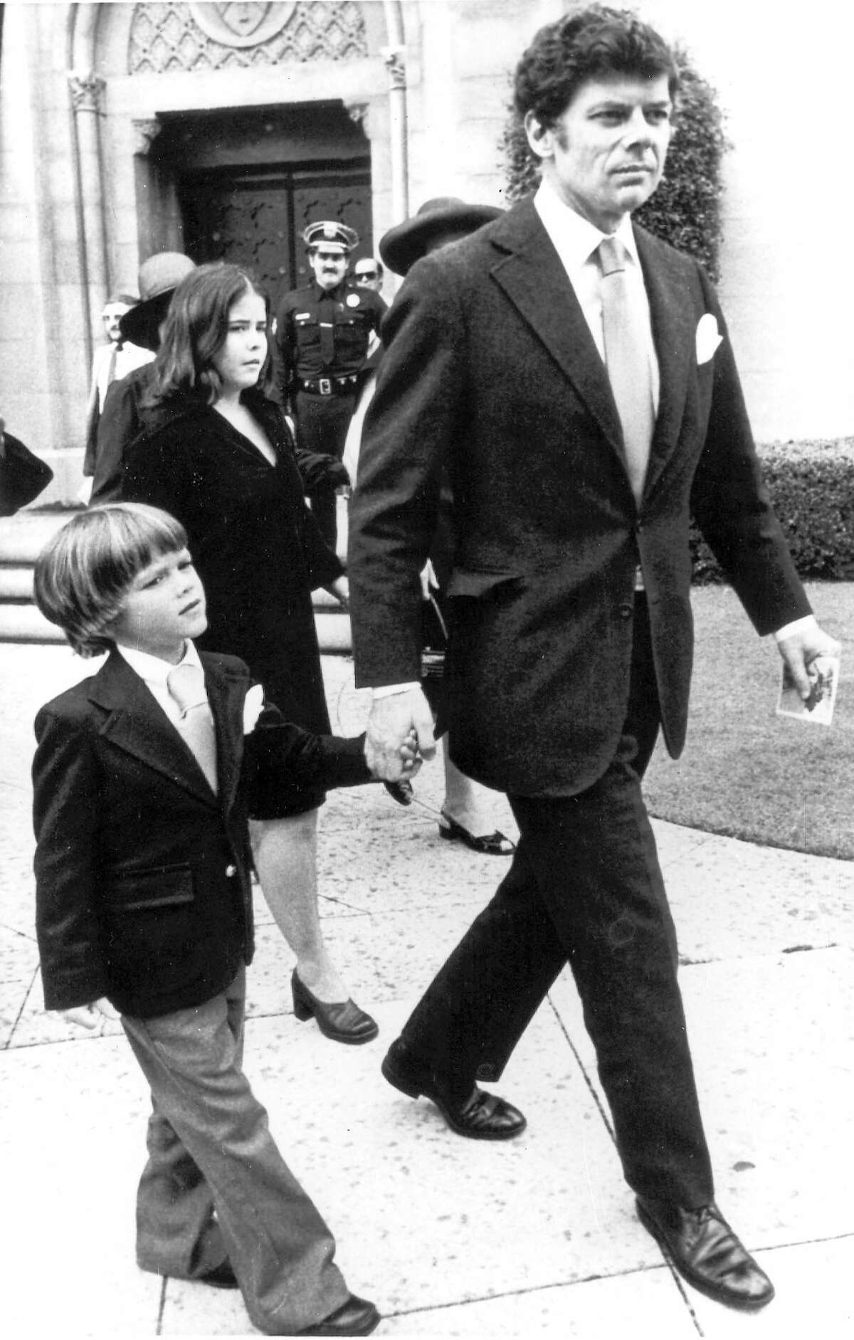 FILE - In this June 10, 1976 file photo, Gordon Getty with his son Andrew leaves the Wilshire United Methodist church after memorial services for J. Paul Getty, in Los Angeles. A man has been found dead at the Hollywood Hills home of Andrew Getty, grandson of the late J. Paul Getty and heir to the Getty oil fortune - but they havenít confirmed that it is Getty. Los Angeles police Officer Jack Richter says officers went to the home shortly after 2:15 p.m. Tuesday, March 31, 2015, after a woman called to say someone in the house had died. (AP Photo/File)