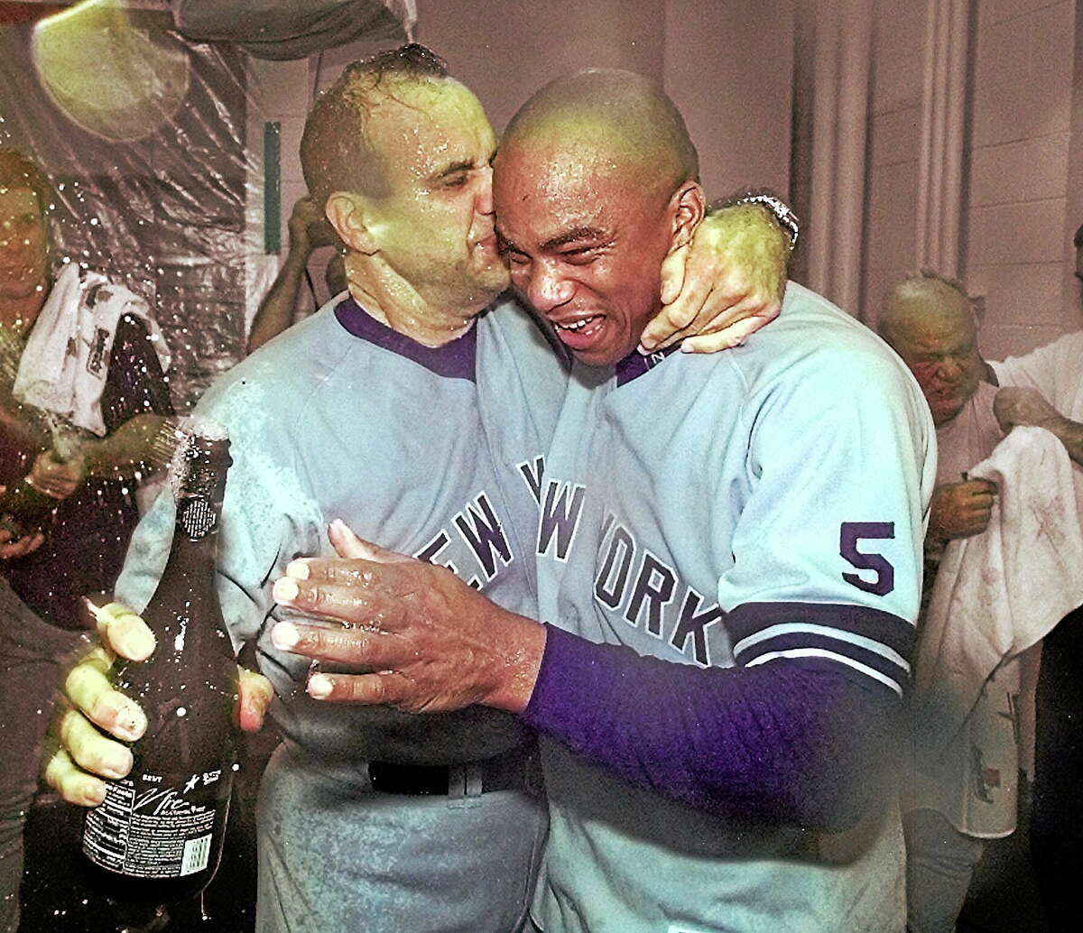 Former New York Yankees pitcher Orlando Hernandez, right, here with manager Joe Torre after the Yankees beat the Rangers to win the 1999 ALDS, is back with the Yankees as a spring training pitching instructor.