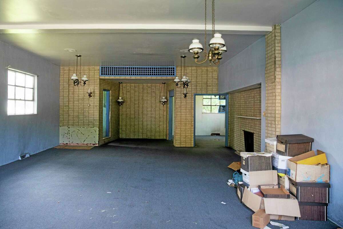 A view of the inside of the former Minus Funeral Home in Dover, Del., Thursday, Aug. 7, 2014, where police say the cremated remains of nine victims of a 1978 mass cult suicide-murder in Jonestown, Guyana, were discovered. The state Division of Forensic Science has taken possession of the remains, discovered at the former Minus Funeral Home in Dover, and is working to make identifications and notify relatives, the agency and Dover police said in a statement. The division last week responded to a request to check the former funeral home after 38 containers of remains were discovered inside. Thirty-three containers were marked and identified. They spanned a period from about 1970 to the 1990s and included the Jonestown remains. (AP Photo/Evan Vucci)