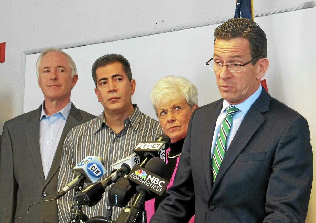 CTMirror.org photo ¬ Gov. Dannel Malloy was joined by Lt. Gov. Nancy Wyman, legislators and Mayor Bill Finch, at left, at a recent announcement for his minimum wage proposal in Bridgeport. ¬