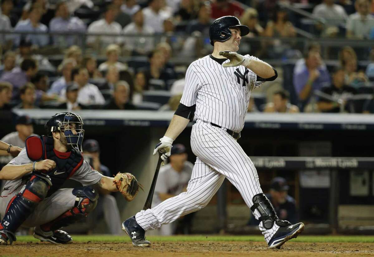 The Yankees’ Brian McCann watches a sixth-inning RBI double against the Boston Red Sox on Tuesday. McCann added a three-run homer in the Yankees’ 13-3 win.