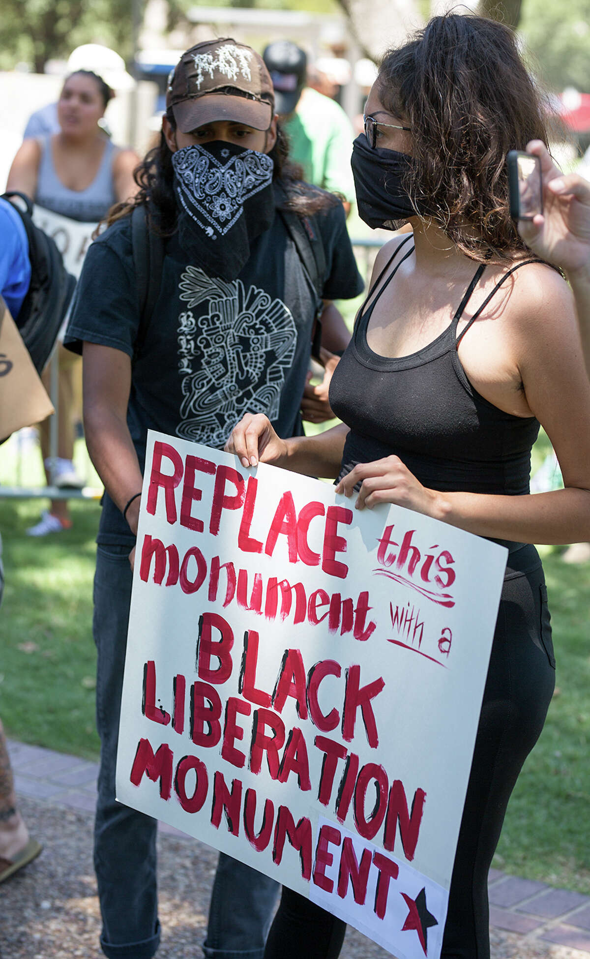 Two groups of protesters squared off in Travis Park Saturday Aug. 12, 2012, over a statue honoring Confederate dead.