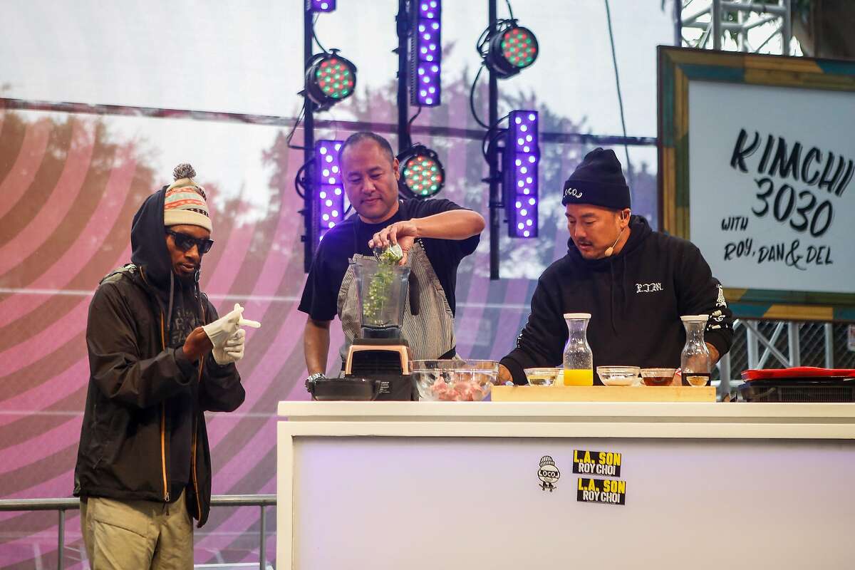 Del the Funky Homosapien, left, producer Dan the Automator, middle, Chef Roy Choi, right, demo a marinated rib recipe on the GastroMagic Stage during the 10th annual Outside Lands Festival in Golden Gate Park in San Francisco on Saturday, August 12, 2017.