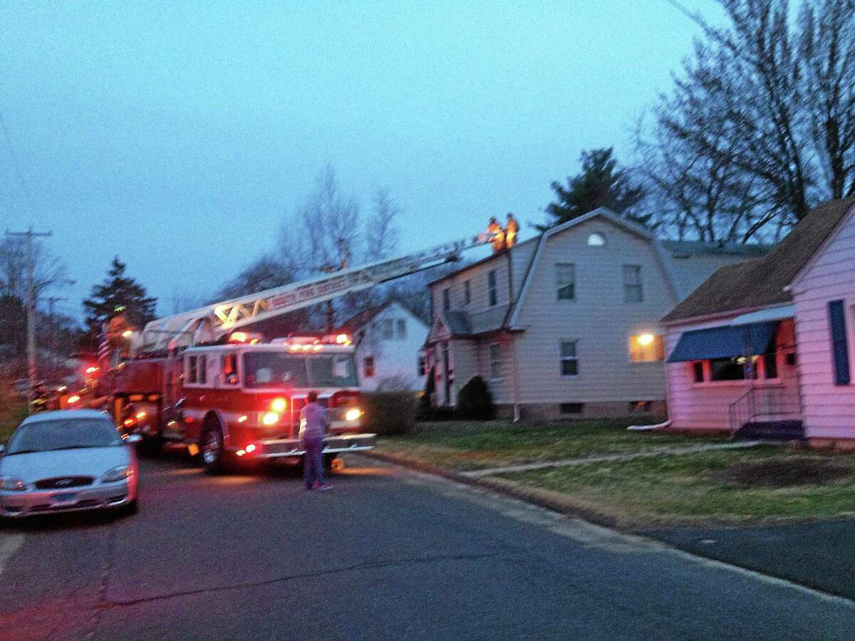 Jeff Mill - The Middletown Press South Fire District Firefighter to a fire at a Frissell Street home Friday evening.