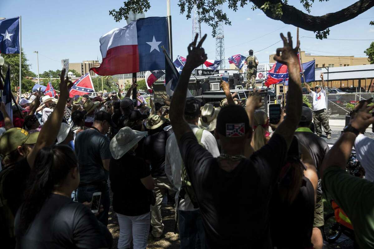 Lamar "Smoke" Russell raps during a rally held by Texas Freedom Force to protest the removal of the confederate monument in Travis Park in San Antonio, Texas on August 12, 2017. Texas Freedom Force, a group dedicated to protecting Texas history, hosted a rally to protest the removal of the confederate monument. At the same time, SATX4, a community organization similar to Black Lives Matter, held a counter-protest.