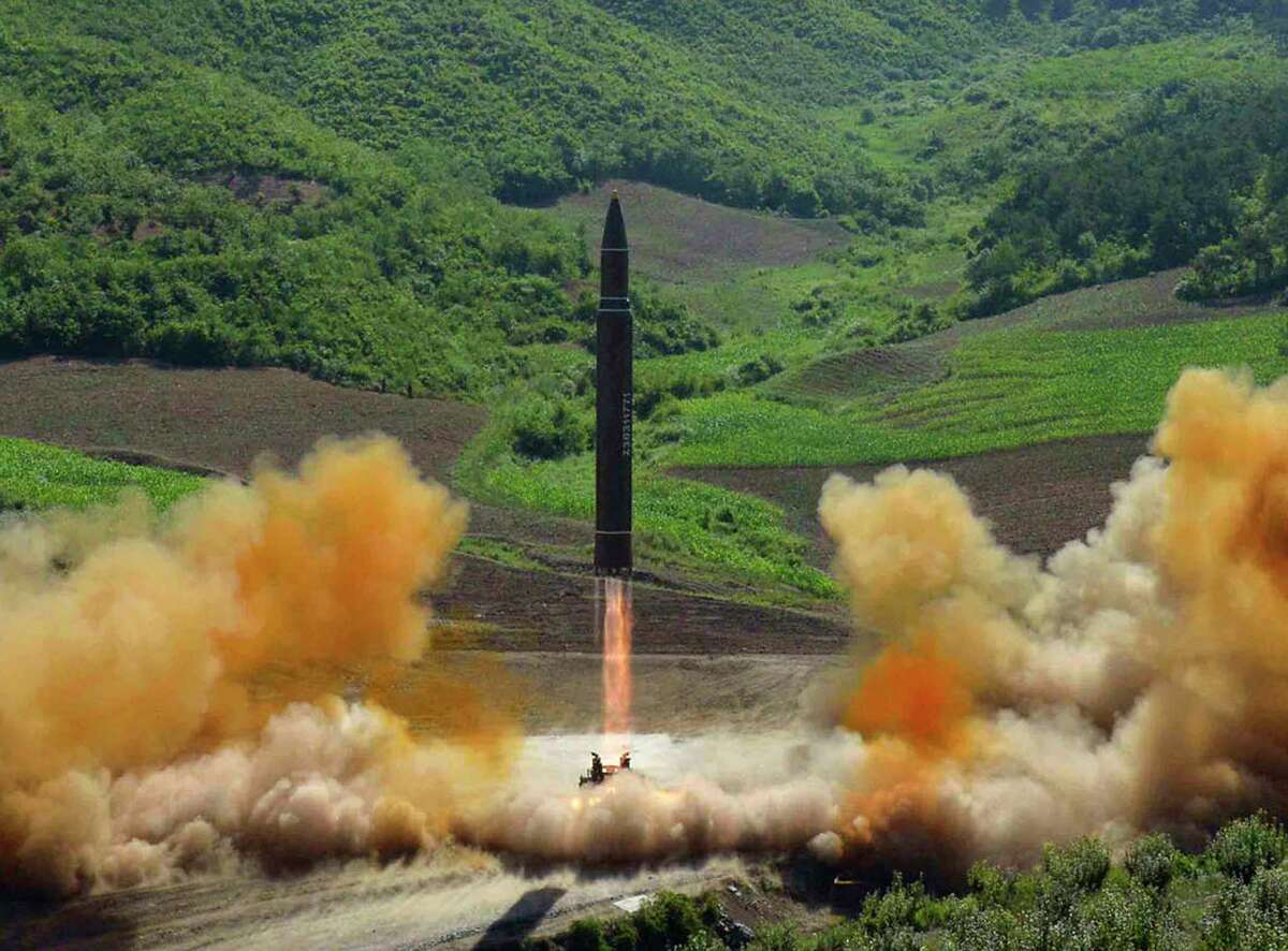 FILE - This file photo distributed by the North Korean government shows what was said to be the launch of a Hwasong-14 intercontinental ballistic missile, ICBM, in North Korea's northwest, Tuesday, July 4, 2017. Independent journalists were not given access to cover the event depicted in this photo. No need to duck and cover just yet. U.S. intelligence officials are pretty sure North Korea can put a nuclear warhead on an intercontinental missile that could reach the United States. Experts aren?’t convinced the bomb could survive the flight to America. (Korean Central News Agency/Korea News Service via AP, File) ORG XMIT: WX202