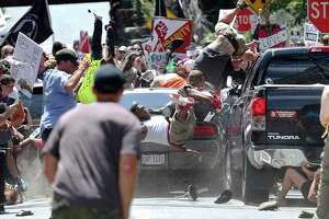 Deadly chaos as car hits crowd after rally by white nationalists