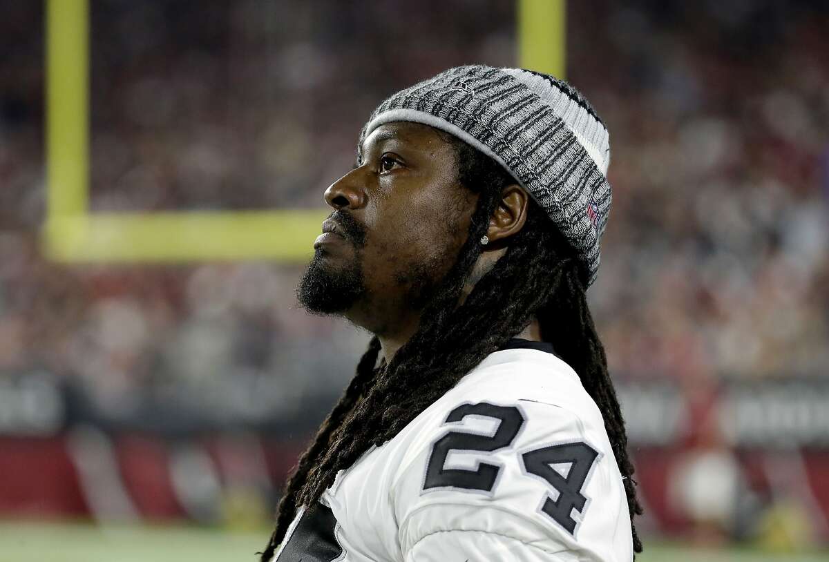 Marshawn Lynch sits during the national anthem in Raiders preseason opener