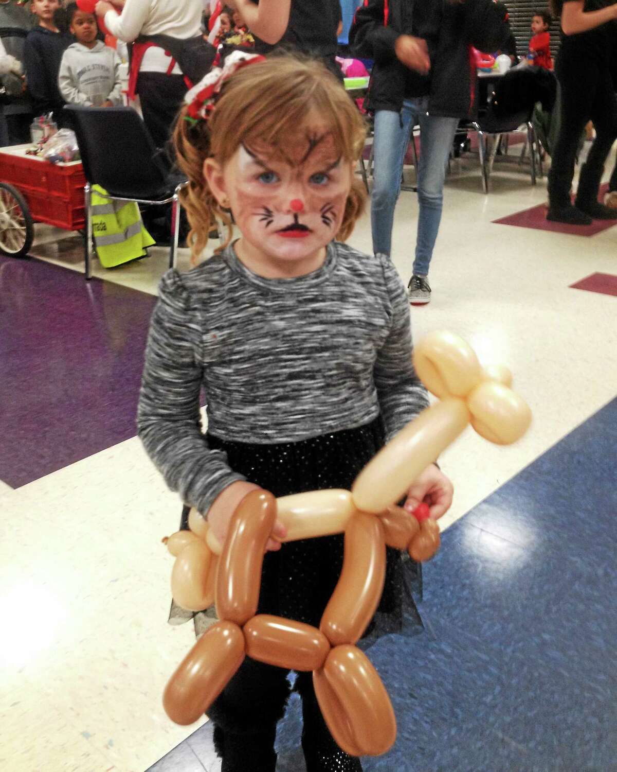 Children of all ages enjoyed watching — and receiving — their very own balloon creations courtesy of Noodles at the holiday party organized by Cromwell Youth Services staff and Cromwell High School Student Council members.