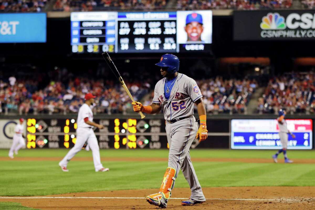 New York Mets' Yoenis Cespedes walks back to the dugout after striking out against Philadelphia Phillies relief pitcher Ricardo Pinto during the eighth inning of a baseball game, Saturday, Aug. 12, 2017, in Philadelphia. Philadelphia won 3-1. (AP Photo/Matt Slocum) ORG XMIT: PXS112