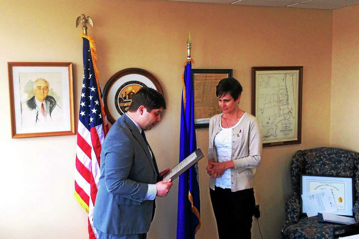 Mayor Daniel Drew presents Amy Garofalo with a city proclamation for Multiple Myeloma Awareness Month.