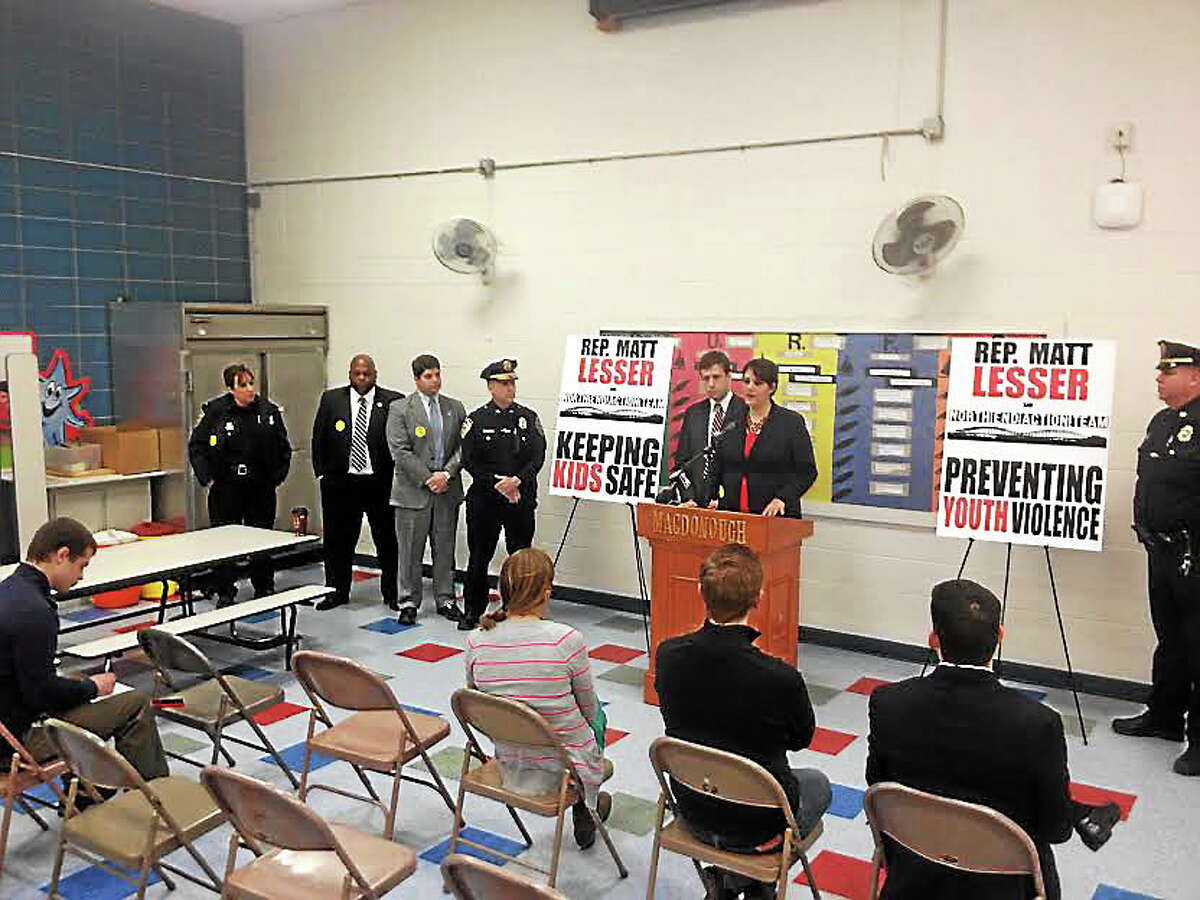Alex Gecan - The Middletown Press Bobbye Knoll Peterson of the North End Action Team and Rep. Matt Lesser joined city officials and police Monday to talk about violence-reduction measures in Middletown, including a gun buy-back scheduled for this Saturday.