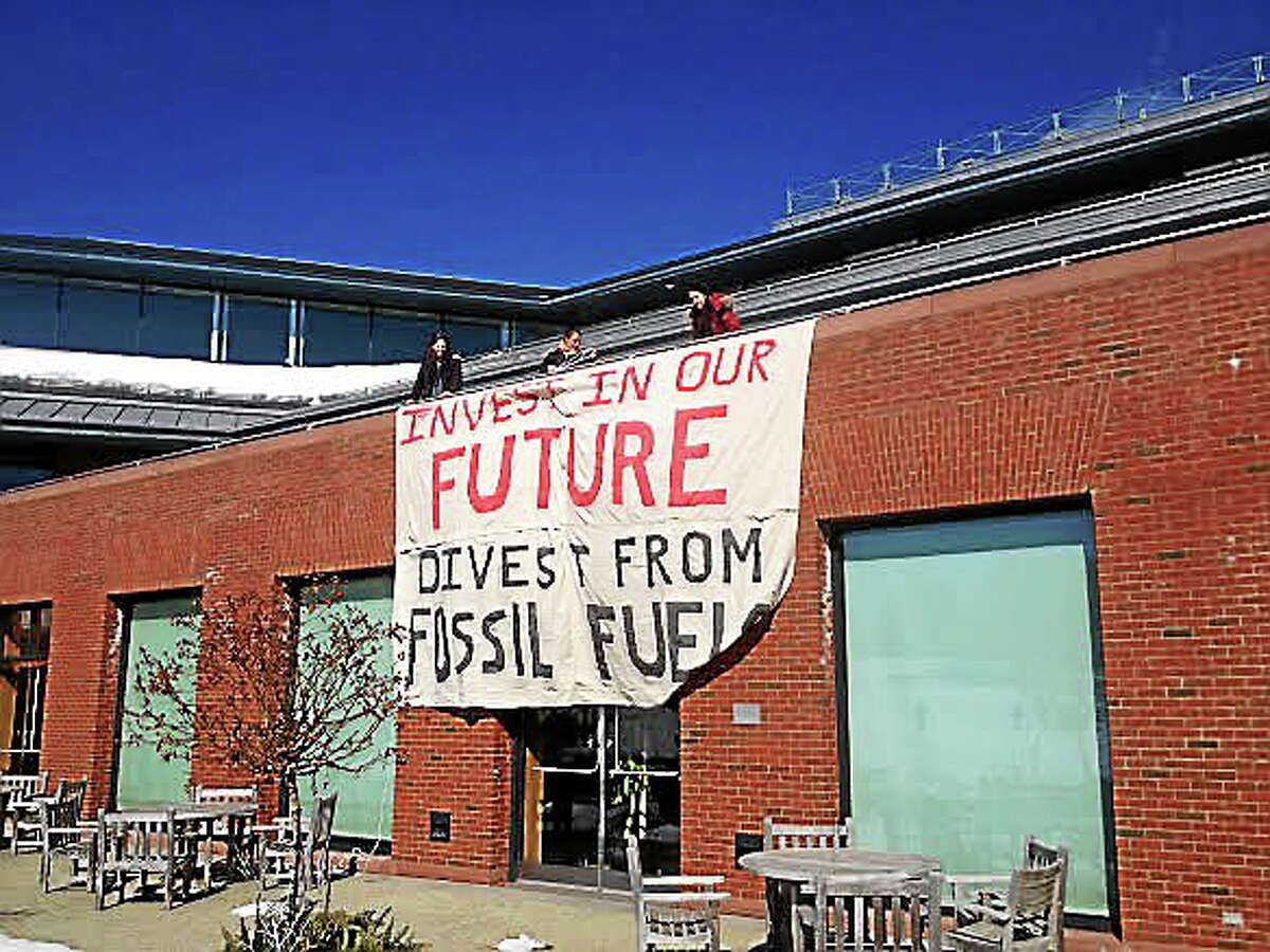 Alex Gecan, The Middletown Press. Wesleyan University students protested the use of fossil fuels on campus in Middletown.