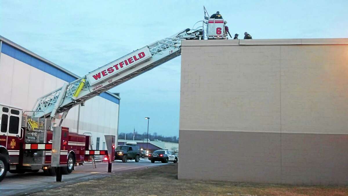 Middletown Police Department photo ¬ Westfield Fire provided a ladder truck to remove a burglary suspect safely from the roof of Electrical Wholesalers in Middletown.