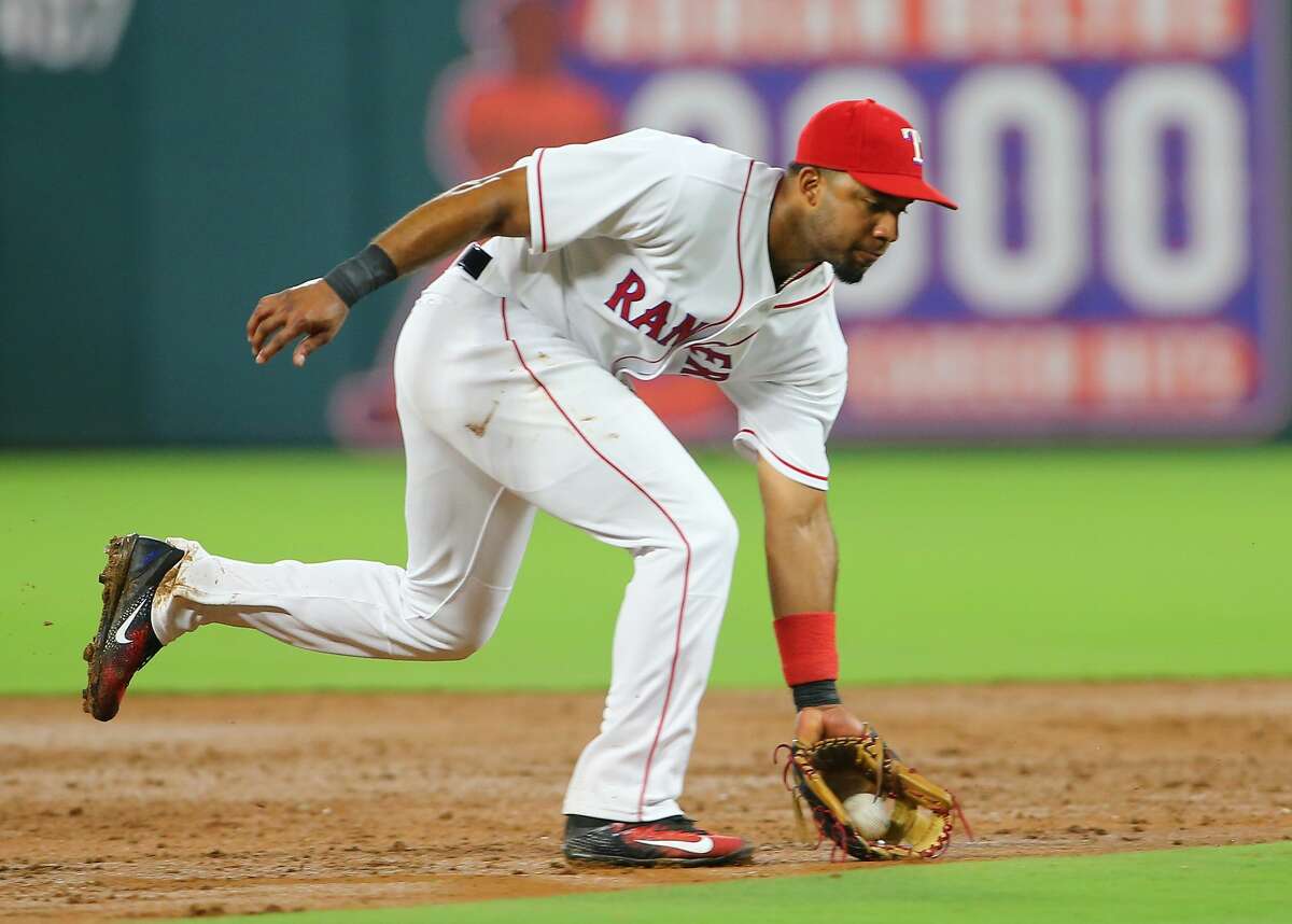 ARLINGTON, TX - AUGUST 12: Elvis Andrus #1 of the Texas Rangers fields a ground ball in the fourth inning against the Houston Astros at Globe Life Park in Arlington on August 12, 2017 in Arlington, Texas. (Photo by Rick Yeatts/Getty Images)