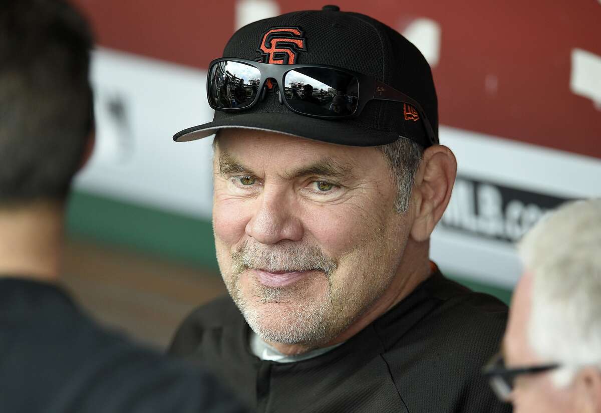 FILE – San Francisco Giants manager Bruce Bochy talks with reporters in the dugout before a baseball game against the Washington Nationals in Washington in this Saturday, Aug. 12, 2017 file photo. In the firmest voice he uses in public, Giants manager Bruce Bochy said during batting practice Friday, "We have not stopped playing. Nobody here is saying the season is over."