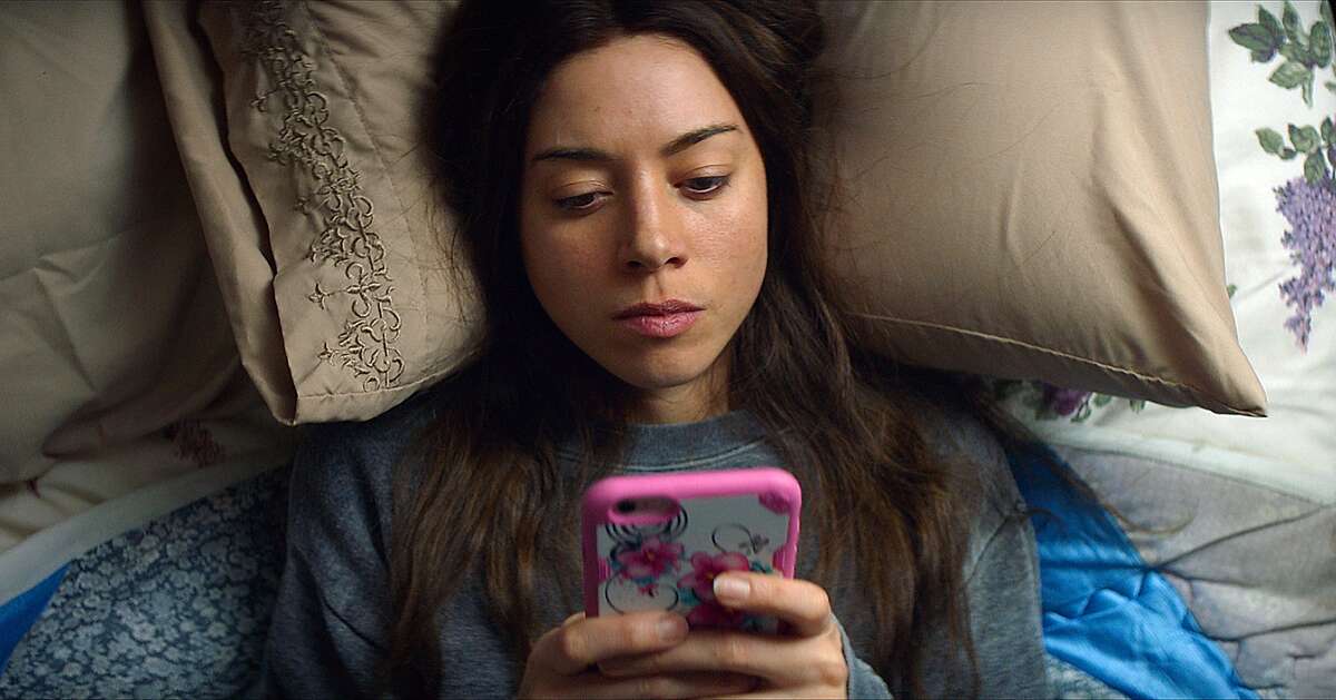 This image released by Neon shows Aubrey Plaza in a scene from, "Ingrid Goes West." Plaza plays a woman who becomes obsessed with a woman on Instagram, played by Elizabeth Olsen. She goes so far as to start dressing and acting like her and eventually even befriends her social media idol. (Neon via AP)