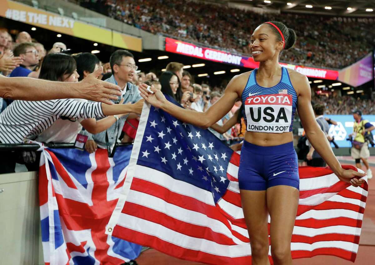 United States' gold medal winner Allyson Felix celebrates with fans after the women's 4x400-meter relay final during the World Athletics Championships in London Sunday, Aug. 13, 2017. (AP Photo/Kirsty Wigglesworth)