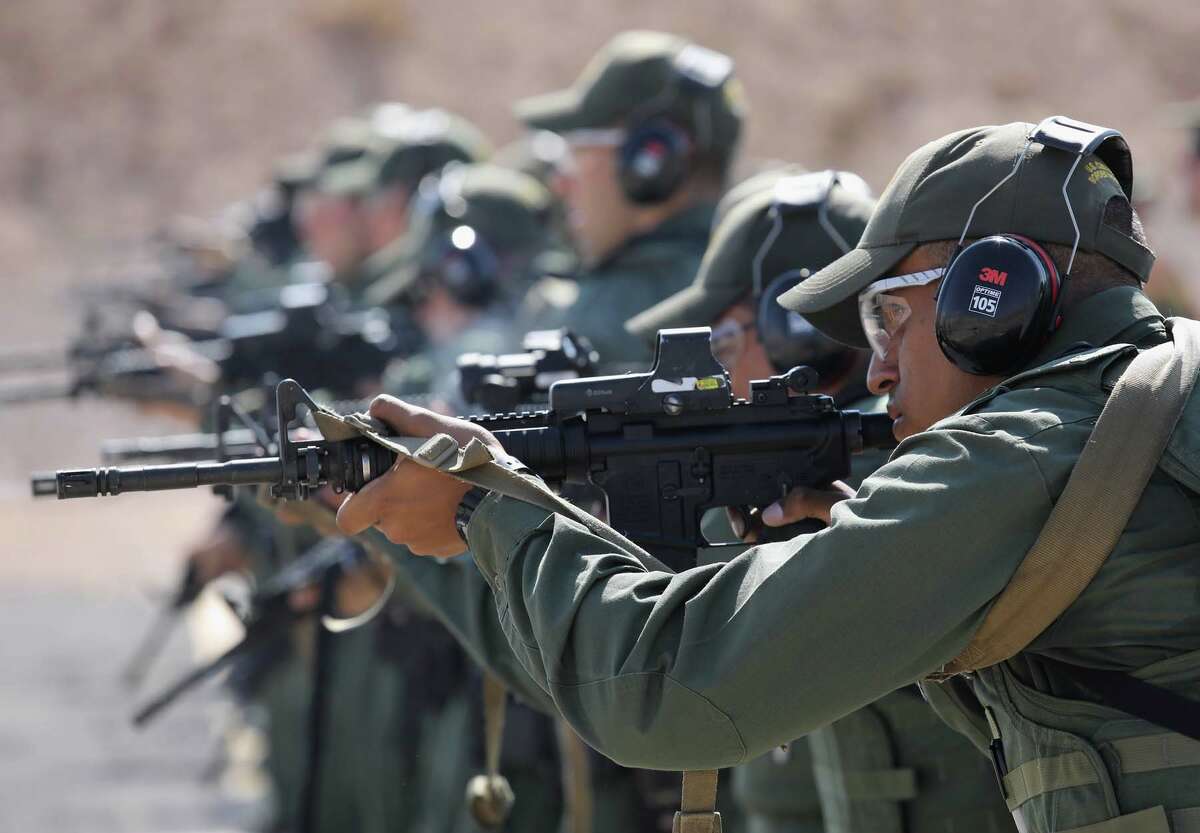 U.S. Border Patrol trainees fire M-4 rifles during a weapons training class at the U.S. Border Patrol Academy on August 3, 2017 in Artesia, New Mexico.