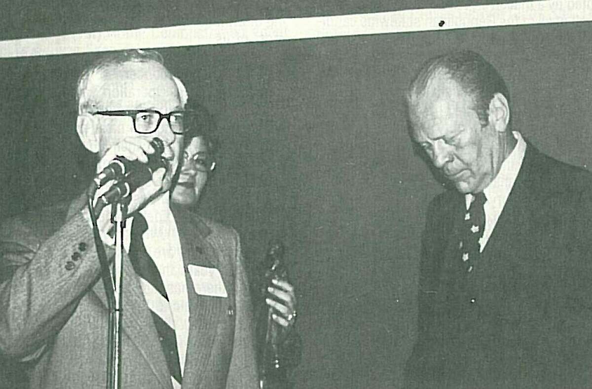 Dr. Walter Wilkerson announces President Gerald Ford at a reception when Ford visited Conroe in 1976.