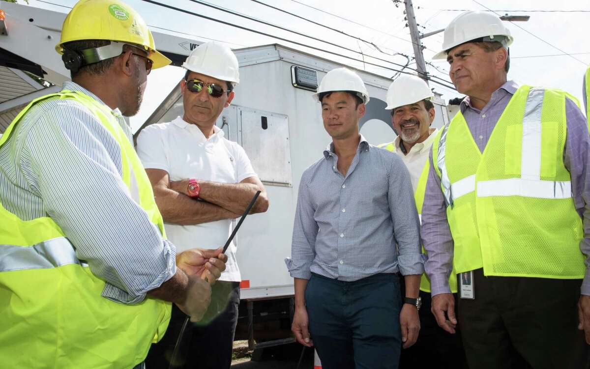 Altice founder Patrick Drahi (second from left) is joined by Altice USA CEO Dexter Goei (center) at a fiber deployment site on Long Island, N.Y.