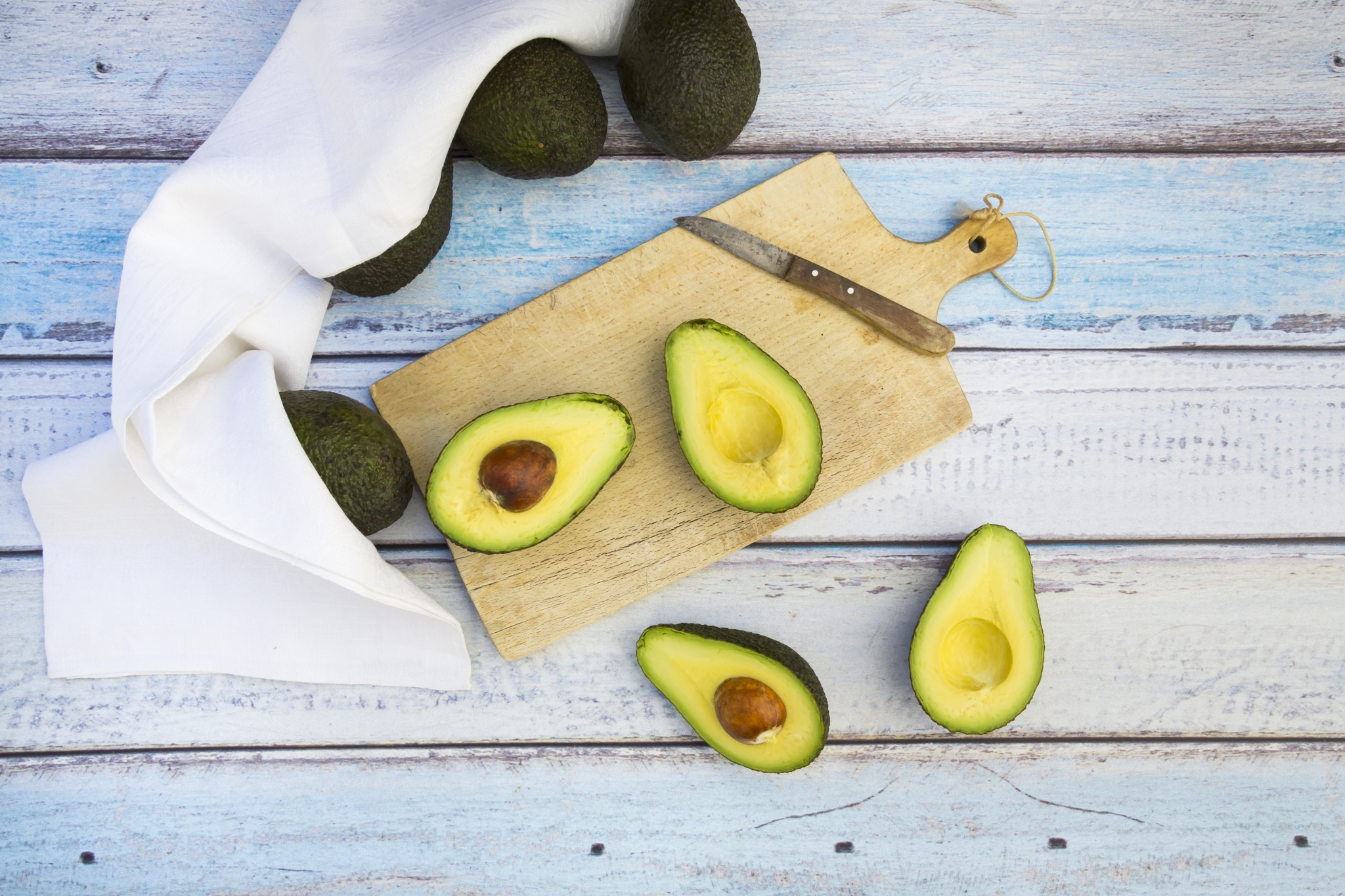 Avocado and knife on cutting board on old wooden table backgroun Photograph  by Liss Art Studio - Pixels