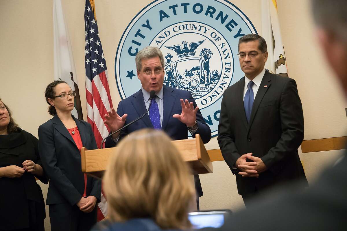 San Francisco City Attorney Dennis Herrera announcing with California Attorney General Xavier Becerra new lawsuits against the Trump Administration?'s "sanctuary jurisdiction" policies at SF City Hall on Monday, Aug. 14, 2017 in San Francisco, CA. At left is Yvonne Mere, Chief Attorney of Complex and Affirmative Litigation and Mollie Lee, Deputy City Attorney.