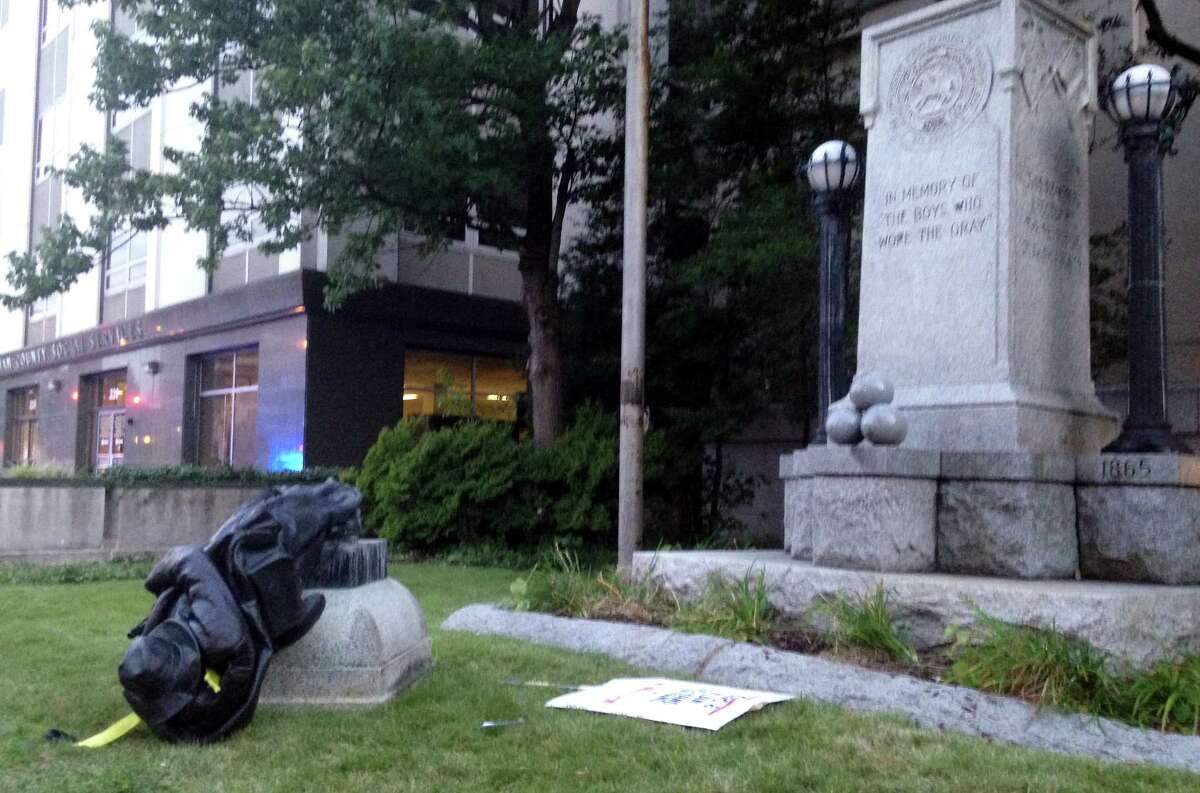 Protestors tied a rope around and toppled a Confederate statue on Monday, Aug. 14, 2017, in Durham, N.C.