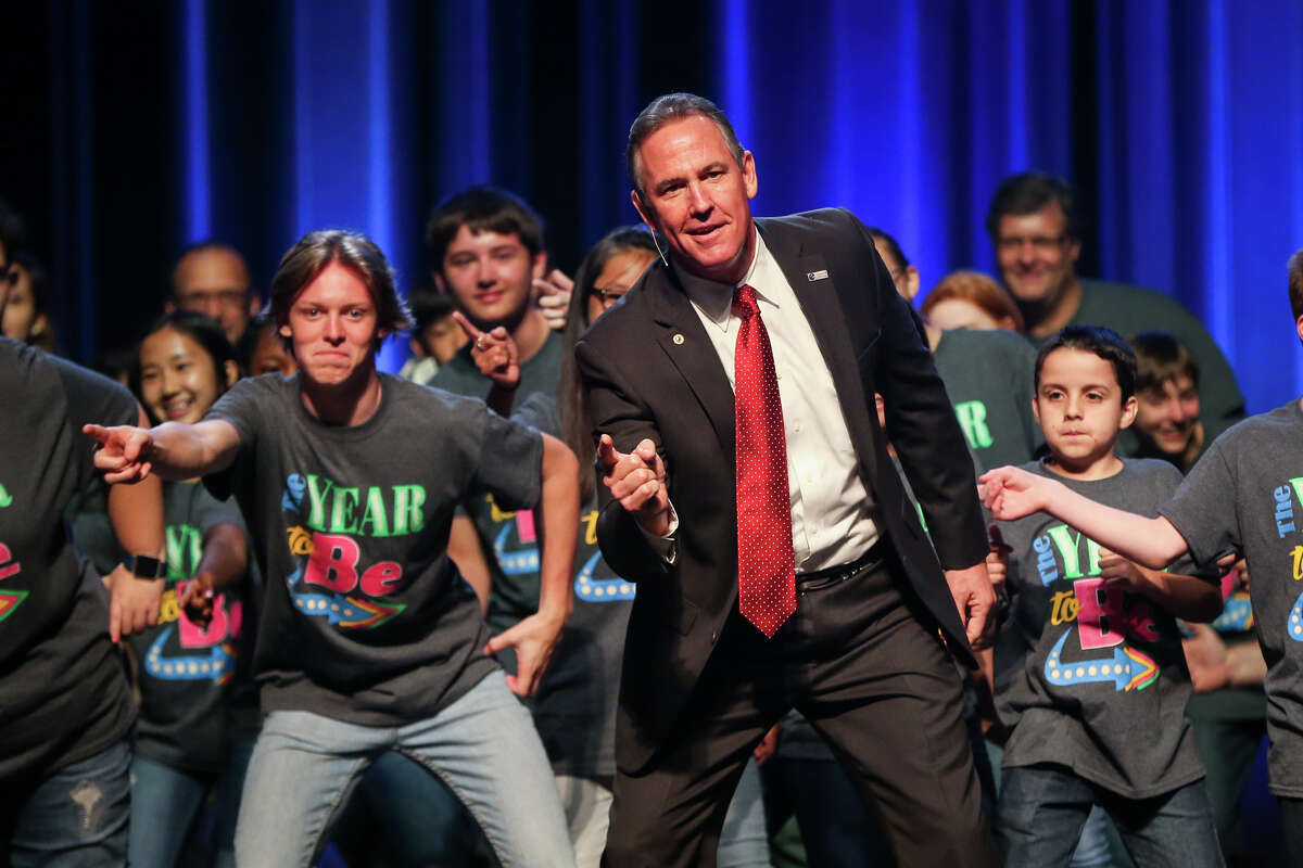 Conroe ISD Superintendent Don Stockton dances with students during the CISD Annual Back-to-School Assembly on Monday at The Woodlands Church.