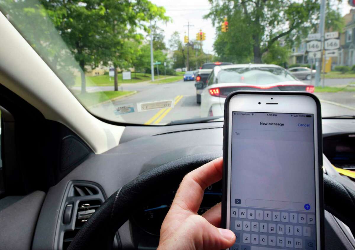 ticket for being on phone at red light