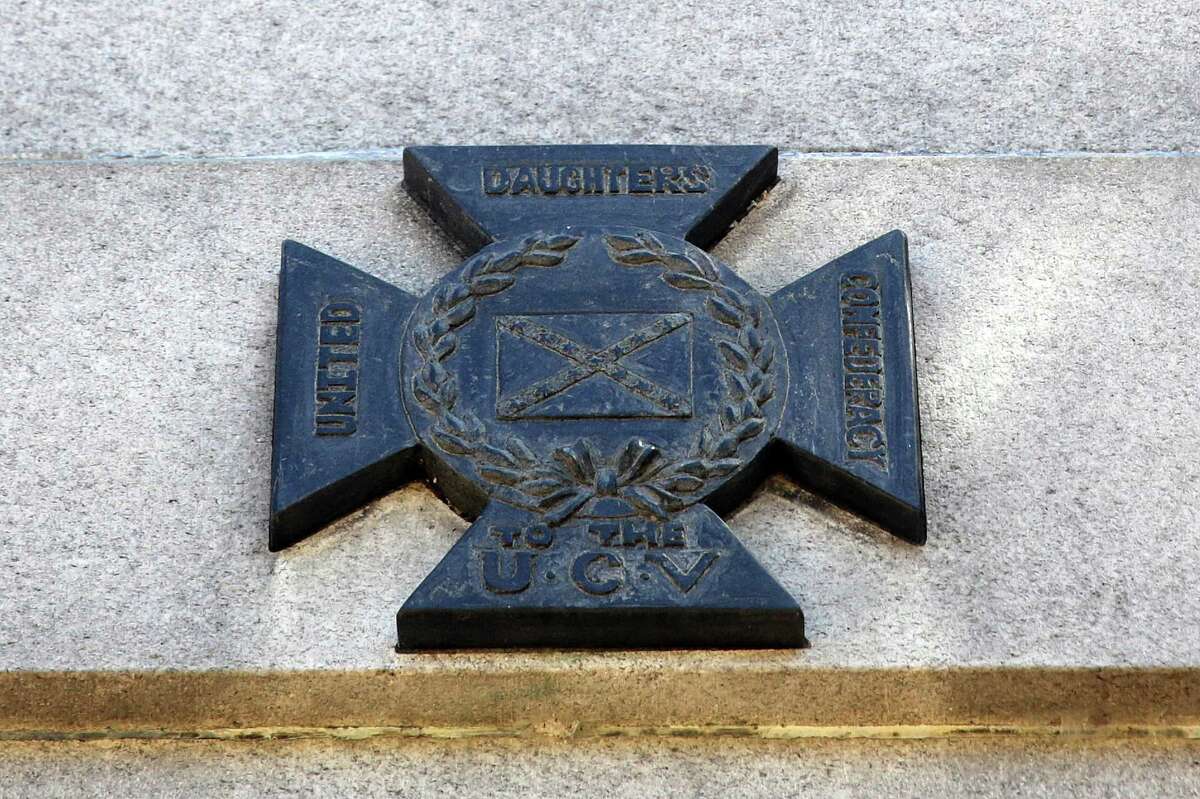 A memorial to the United Confederate Veterans stand in Lakeview Cemetery in Capitol Hill. Photographed Aug. 15, 2017, the insignia has now been vandalized for at least the third time since 2005. It was erected in 1926 and paid for by the United Daughters of the Confederacy.