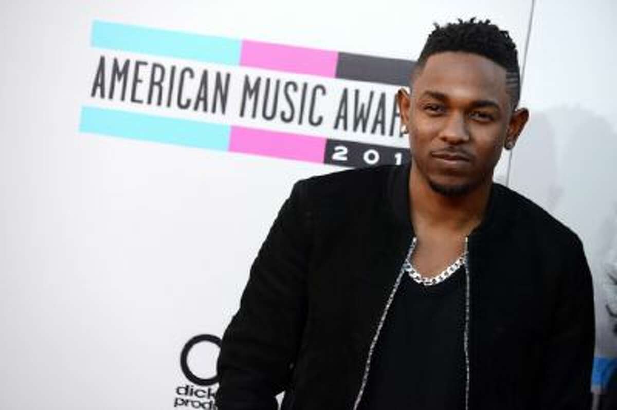 In this Nov. 24, 2013 photo, Kendrick Lamar arrives at the American Music Awards at the Nokia Theatre L.A. Live, in Los Angeles.